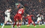 Manchester United's Ivorian midfielder #16 Amad Diallo (R) shoots to score their second goal during the English Premier League football match between Liverpool and Manchester United at Anfield in Liverpool, north west England on January 5, 2025. (Photo by Darren Staples / AFP) 