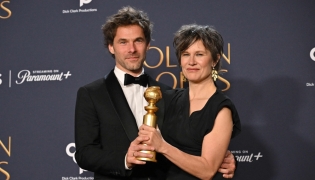 French composer Clement Ducol (L) and French singer Camille accept the award for song Best Original Song - Motion Picture for 