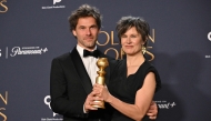 French composer Clement Ducol (L) and French singer Camille accept the award for song Best Original Song - Motion Picture for 