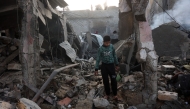  A Palestinian boy walks amid the destruction following an Israeli strike that hit the home of the Ghoula family in the Shujaiya neighbourhood of Gaza City, in the northern Gaza Strip on January 4, 2025. Photo by Omar AL-QATTAA / AFP