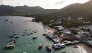 This aerial photo taken on June 15, 2024 shows tourist and fisher boats at Mae Head pier on Koh Tao island in the southern Thai province of Surat Thani. Photo by Lillian SUWANRUMPHA / AFP