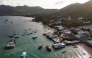 This aerial photo taken on June 15, 2024 shows tourist and fisher boats at Mae Head pier on Koh Tao island in the southern Thai province of Surat Thani. Photo by Lillian SUWANRUMPHA / AFP