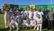 South Africa's Temba Bavuma (C) holds up the trophy after winning the Test match series, following the fourth day of the second international Test cricket match between South Africa and Pakistan, at Newlands stadium in Cape Town on January 6, 2025. (Photo by Rodger Bosch / AFP)