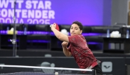 Qatar's Ahmed Korani in action during his match against Singapore's Li Yan Jun.