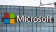 This photograph shows a view of Microsoft's logo on the company's French headquarters in Issy-les-Moulineaux on the outskirts of Paris on January 6, 2025. (Photo by Martin LELIEVRE / AFP)