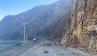 This frame grab from a user-generated content (UGC) video on January 7, 2025 shows rocks on a road near the Shigatse national highway in China's Tibet after an earthquake struck the area. (Photo by UGC / AFP) 