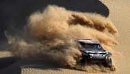 Qatari driver Nasser Al Attiyah steers his car assisted by his co-driver Edouard Boulanger during stage 2B of the 47th Dakar Rally between Bisha and Bisha, on January 6, 2025. (Photo by Valery Hache / AFP)