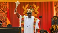 Ghana's new President John Mahama holds state sword after taking the oath of office at his inauguration at the Independence Square in Accra on January 7, 2025. (Photo by Nipah Dennis / AFP)