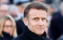 France's President Emmanuel Macron looks on as he takes part in a wreath-laying ceremony to pay tribute to Ahmed Merabet, a Muslim police officer guarding the offices who was executed at point-blank range, as part of marking 10 years since an attack on the Charlie Hebdo satirical newspaper, on January 7, 2025.  (Photo by Ludovic Marin  / AFP) 