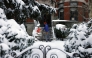 Langley Bowers shovels the snow off his stoop on Capitol Hill on January 6 as a major snowstorm blankets the city. (Photo by Robb Hill for The Washington Post)

