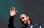 Mercedes' British driver Lewis Hamilton waves as he arrives for the podium ceremony after the Formula One Belgian Grand Prix at the Spa-Francorchamps Circuit in Spa on July 28, 2024. (Photo by SIMON WOHLFAHRT / AFP)

