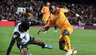 Valencia's Spanish defender #03 Cristhian Mosquera challenges Real Madrid's Brazilian forward #07 Vinicius Junior (R) during the Spanish league football match between Valencia CF and Real Madrid CF at the Mestalla stadium in Valencia on January 3, 2025. (Photo by JOSE JORDAN / AFP)