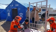 Rescuers assemble beds for quake-affected residents at a resettlement site in a village in Dingri County in Xigaze, southwest China's Xizang Autonomous Region, Jan. 8, 2025. (Xinhua/Shen Bohan)
