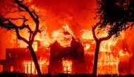 A home is engulfed in flames during the Eaton fire in the Altadena area of Los Angeles County, California on January 8, 2025. (Photo by Josh Edelson / AFP)

