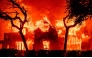 A home is engulfed in flames during the Eaton fire in the Altadena area of Los Angeles County, California on January 8, 2025. (Photo by Josh Edelson / AFP)

