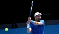 Serbia's Novak Djokovic hits a return during a training session ahead of the Australian Open tennis tournament in Melbourne on January 9, 2025. (Photo by William West / AFP) 