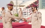 Commander of the Amiri Guard Lt. Gen. Staff Hazza bin Khalil Al Shahwani honouring one of the top graduating students at the event.