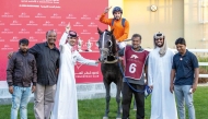 The connections of El Ghazi celebrate their Al Gharafa Cup victory.