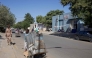 A Chadian soldier (L) looks on as a man with a cart gestures on a street in the Djambal Bahr district of N'Djamena on January 9, 2025. (Photo by Joris Bolomey / AFP)