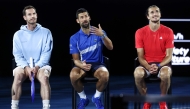 :Britain’s Andy Murray (L) reacts with Serbia’s Novak Djokovic (C) and Germany’s Alexander Zverev during a charity event titled ‘Night with Novak’ on Rod Laver Arena in Melbourne on January 9, 2025 ahead of the Australian Open tennis championship starting on January 12. (Photo by DAVID GRAY / AFP)