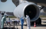 File: Medical staff embark a patient infected with the COVID-19 onboard a French air force medicalised Airbus A330 Phenix aircraft at the Bale-Mulhouse airport in France on March 31, 2020. (Photo by SEBASTIEN BOZON / AFP)