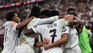 Real Madrid's players celebrate their first goal during the Spanish Super Cup semi-final football match between Real Madrid and Mallorca at the King Abdullah Sport City in Jeddah on January 9, 2025. (Photo by Fadel Senna / AFP)