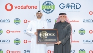 Chief Human Resources Officer at Vodafone Qatar Khames Al Naimi (left) receving the award from Founding Chairman of GORD Dr. Yousef Alhorr.