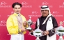 QREC Racing Manager Abdulla Rashid Al Kubaisi hands trophy to jockey Jefferson Smith. PICS: Juhaim/QREC