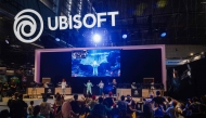 Visitors dance at the Ubisoft stand during the Paris Games Week fair in Paris, on October 23, 2024. Photo by Dimitar DILKOFF / AFP