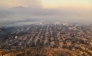 In this aerial view taken from a helicopter, burned homes are seen from above during the Palisades fire near the Pacific Palisades neighborhood of Los Angeles, California on January 9, 2025. Photo by JOSH EDELSON / AFP