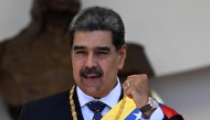  Venezuela's President Nicolas Maduro gestures as he leaves the Capitolio -home of the National Assembly- after taking the oath during the presidential inauguration in Caracas on January 10, 2025. (Photo by Juan Barreto / AFP)
