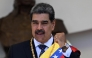  Venezuela's President Nicolas Maduro gestures as he leaves the Capitolio -home of the National Assembly- after taking the oath during the presidential inauguration in Caracas on January 10, 2025. (Photo by Juan Barreto / AFP)
