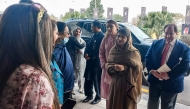 Nobel Peace Prize Laureate Malala Yousafzai (2R) arrives to attend an international summit on 'Girls’ Education in Muslim Communities', in Islamabad on January 11, 2025. (Photo by Zain Zaman Janjua / AFP)