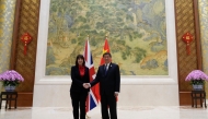 British Treasury chief Rachel Reeves (L) meets Chinese Vice Premier He Lifeng before the start of the Fourth China-UK Financial Services Summit in Beijing in Beijing on January 11, 2025. (Photo by Aaron Favila / Pool / AFP)