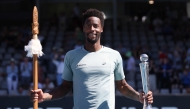 Gael Monfils of France poses with the trophy as he celebrates his win over Zizou Berges of Belgium following their men's singles final match at the ATP Auckland Classic tennis tournament in Auckland on January 11, 2025. (Photo by Michael Bradley / AFP)