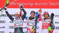 Winner France's Clement Noel (C) celebrates on the podium wih second-placed Brazil's Lucas Braathen (L) and third-placed Norway's Henrik Kristoffersen after the Men's Slalom race as part of the FIS Alpine Ski World Cup 2024-2025, in Adelboden, Switzerland on January 11, 2025. (Photo by FABRICE COFFRINI / AFP)
