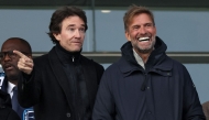 German football trainer and global head of Football at Red Bull, Jurgen Klopp (R) and representative of the Agache family holding company Antoine Arnault are seen prior to the French Ligue 2 football match between Paris football Club (PFC) and Amiens at Stade Charley in Paris, on January 11, 2025. Photo by FRANCK FIFE / AFP