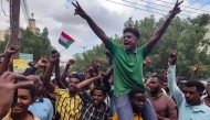 People take to the streets of Port Sudan to celebrate the reported advance of Sudanese military forces and allied armed groups on the key Al-Jazira state capital Wad Madani, held by the paramilitary Rapid Support Forces (RSF), on January 11, 2025. (Photo by AFP)
