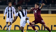 Juventus' French midfielder #19 Khephren Thuram-Ulien (C) and Torino's Italian midfielder #28 Samuele Ricci (R) fight for the ball during the Italian Serie A football match between Torino and Juventus at the Olympic Grande Torino stadium in Turin on January 11, 2025. (Photo by MARCO BERTORELLO / AFP)
