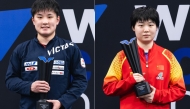 Tomokazu Harimoto (left) and Kuai Man celebrate with their trophies. 