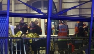 Firefighters tend to injured passengers at the Strasbourg railway station following a collision of two trams, in Strasbourg, eastern France, on January 11, 2025. (Photo by Frederick Florin / AFP)