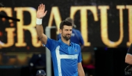 Serbia's Novak Djokovic celebrates his victory against USA's Nishesh Basavareddy during their men's singles match on day two of the Australian Open tennis tournament in Melbourne on January 13, 2025. (Photo by David Gray / AFP) 