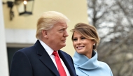 File: US President-elect Donald Trump and wife Melania leave St. John's Episcopal Church on January 20, 2017.  (Photo by Nicholas Kamm / AFP)