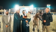 General Supervisor of Souq Waqif Equestrian Festival 2025 Abdulrahman Al Naama (second left) with a winner of a competition at 6th Souq Waqif International Arabian Horse Show (A). 