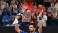 Serbia's Novak Djokovic celebrates after victory against Portugal's Jaime Faria during their men's singles match on day four of the Australian Open tennis tournament in Melbourne on January 15, 2025. (Photo by William West / AFP) /