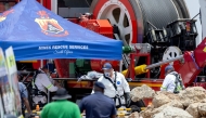 Rescuers use a Metalliferous Mobile Rescue Winder during a rescue operation to retrieve illegal miners from an abandoned gold mine in Stilfontein on January 14, 2025. (Photo by Christian Velcich / AFP)
