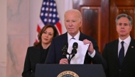 US President Joe Biden, flanked by Vice President Kamala Harris and Secretary of State Antony Blinken, speaks about the Israel-Hamas ceasefire and hostage release deal in the Cross Hall of the White House on January 15, 2025. (Photo by Roberto Schmidt / AFP)