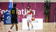 Al Rayyan's Justin Jamel Wright-Foreman (right) in action yesterday.