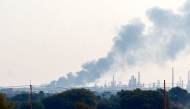 Smoke billows from al-Jaili oil refinery north of Omdurman, the Sudanese capital's twin city, during battles between the Sudanese military forces and paramilitary Rapid Support Forces (RSF), on January 15, 2025. (Photo by AFP)