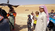 Qatar’s Nasser Al Attiyah (left) at the start of yesterday's stage. AFP